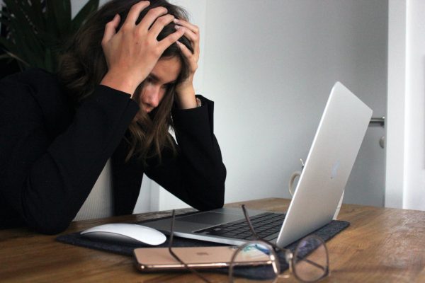 a woman frustrated in front of a computer