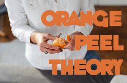A women peeling an orange