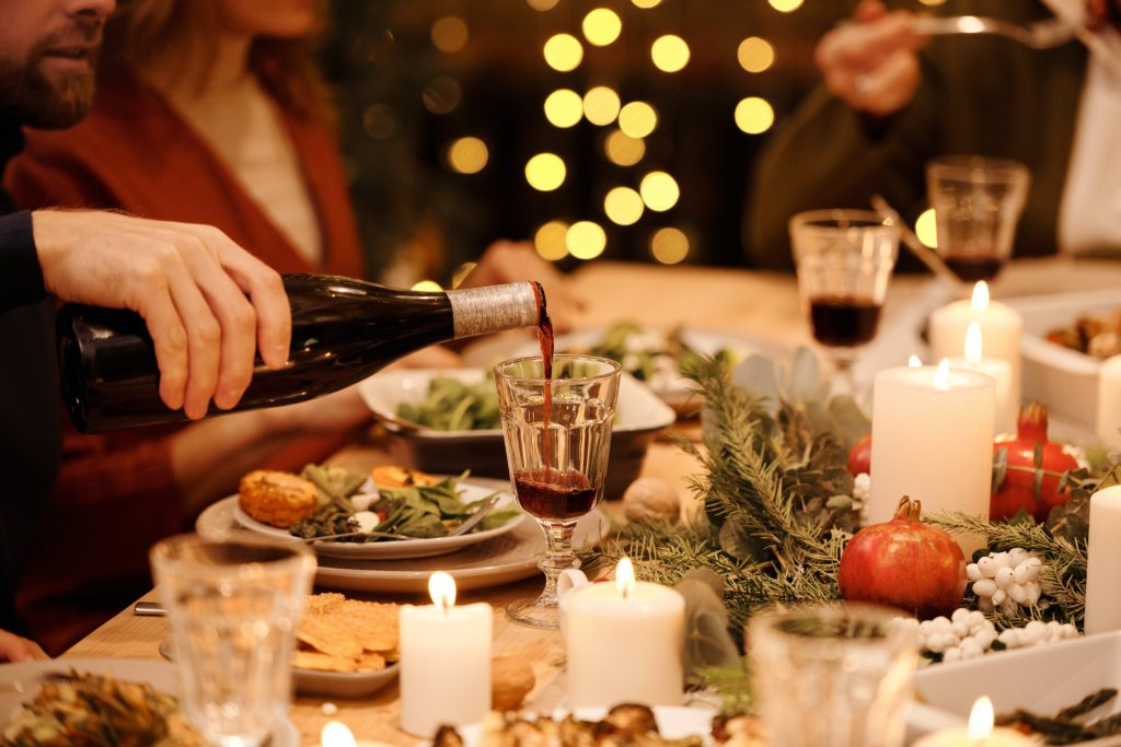 pouring wine on holiday dinner